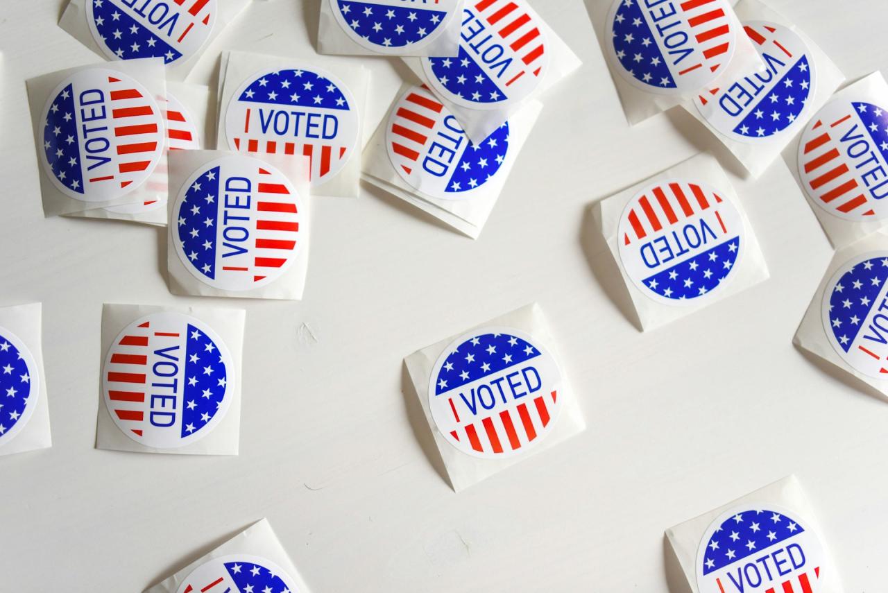 scattered voted stickers on a white background
