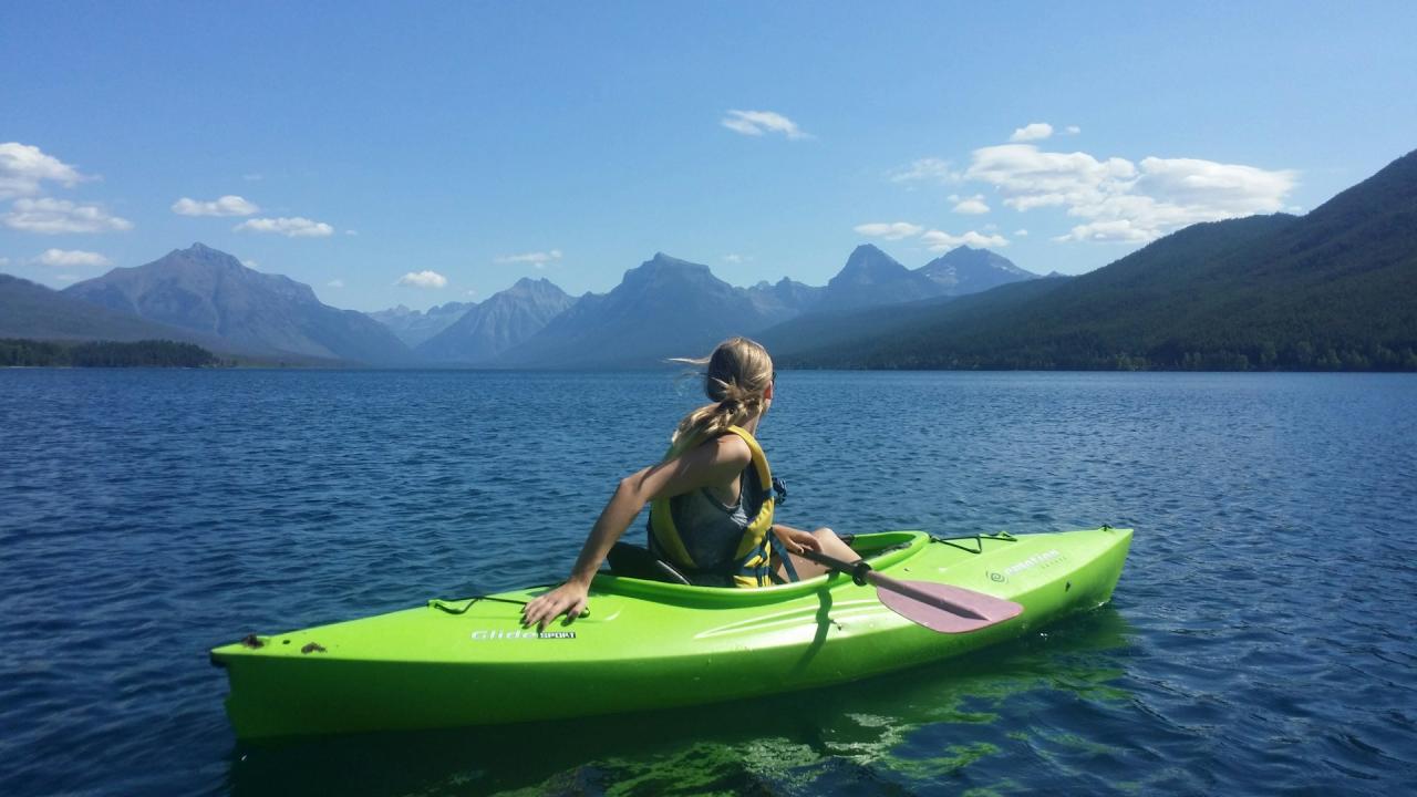 woman in a kayak on a lake