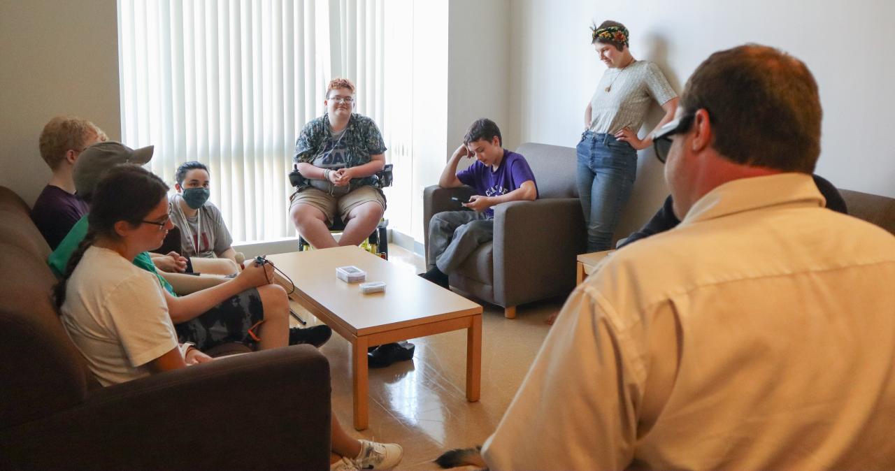 Students gather in the common room of their dorm
