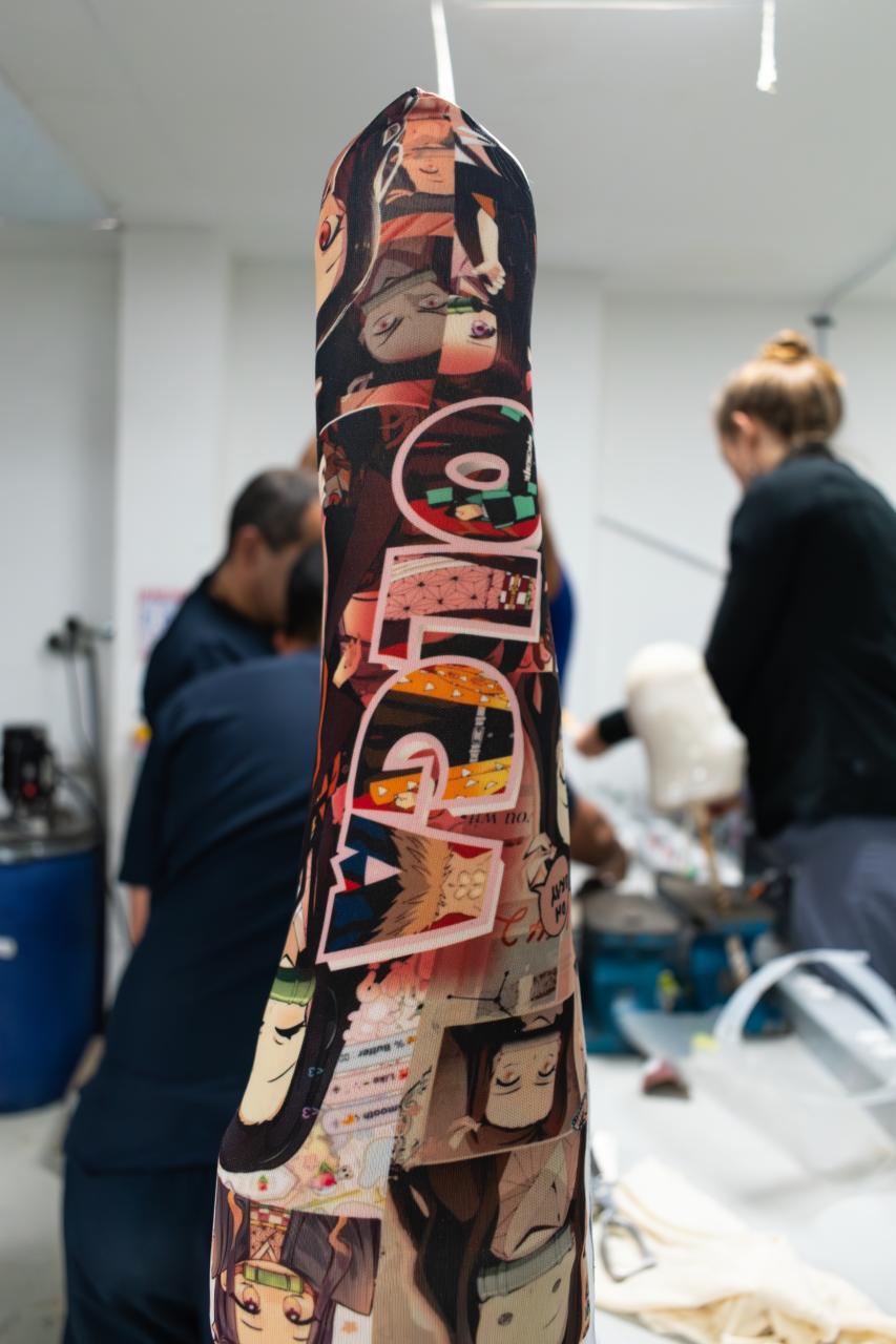 Close-up of young girl's prosthetic leg which she's covered in stickers.