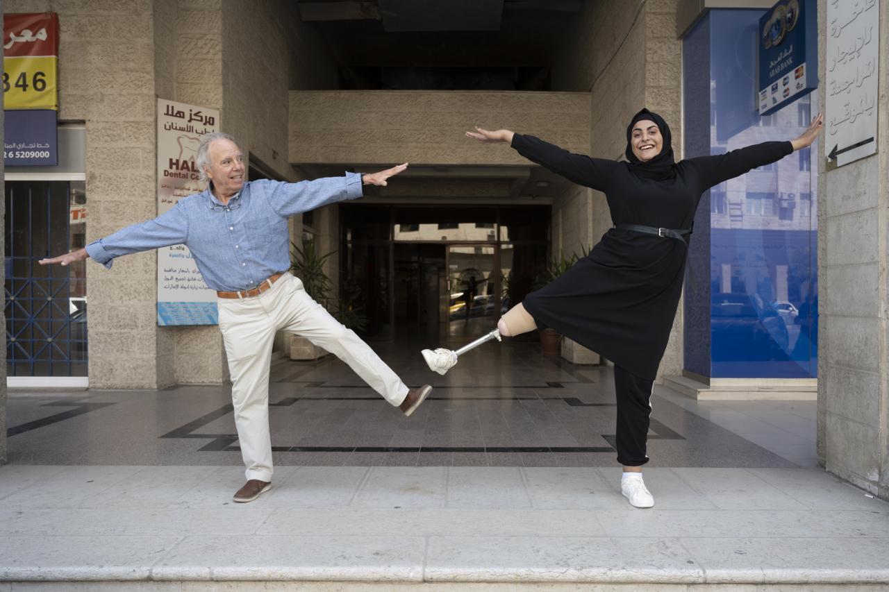 Michael and Eman standing on one leg with arms out. (Photo by Stephen Petegorsky)