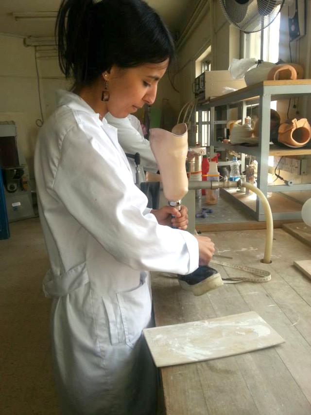 woman working on a prosthetic
